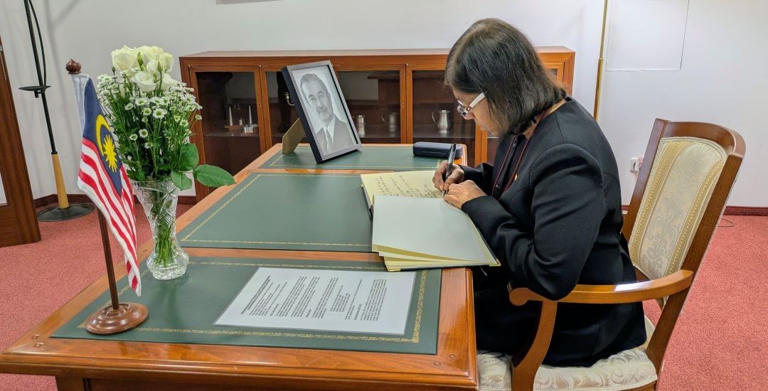 Ambassador signs the book of condolence opened at the Embassy of Malaysia